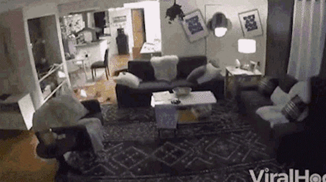 a living room with a couch , chairs and a table