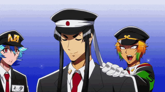 a man wearing a hat with the letter n on it stands between two other men