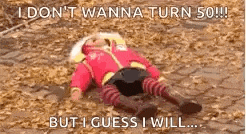 a baby is laying on the ground with a caption that says `` i don t wanna turn 50 ! '' .