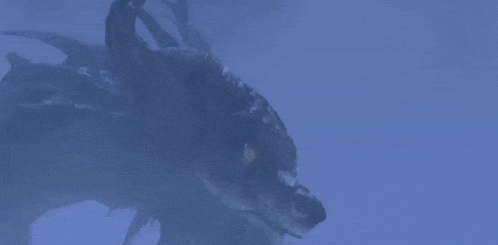 a close up of a dragon 's face with a blue background