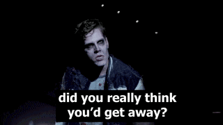 a man with blood on his face is standing on a stage and says did you really think you 'd get away ?