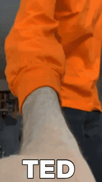 a close up of a person 's leg with the word ted in white letters