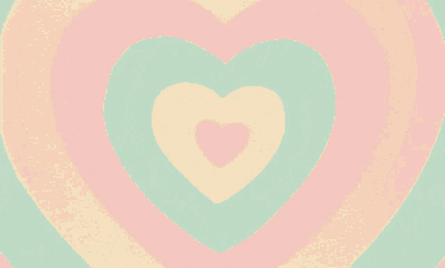 a rainbow colored background with a pink heart in the center