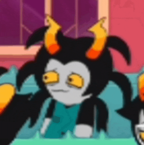 a cartoon character with horns is sitting on a couch and making a sad face .