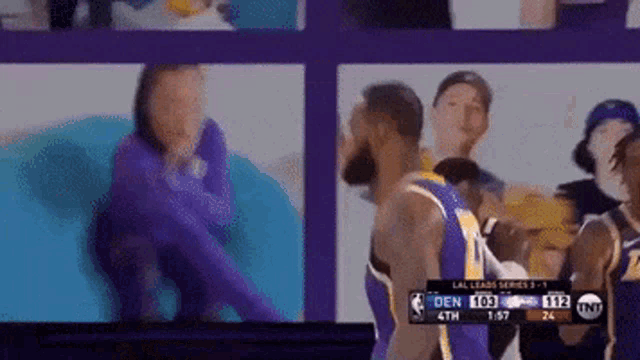 a basketball game is being played between the lakers and the denver nuggets