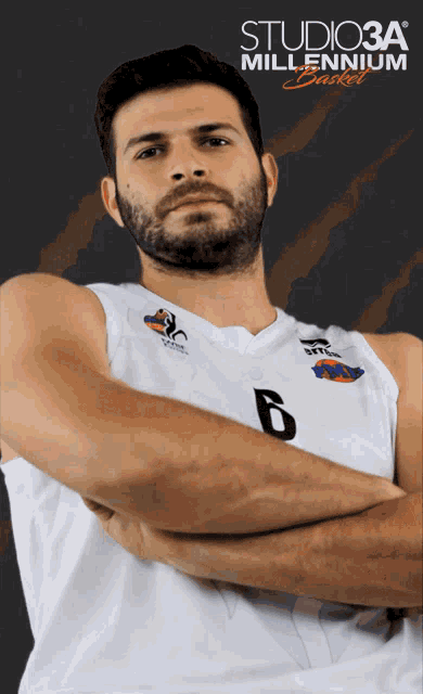 a man with a beard wearing a white jersey with the number 6 on it