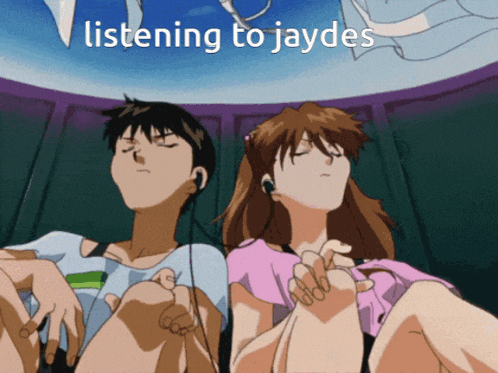 a man and a woman are listening to jaydes music