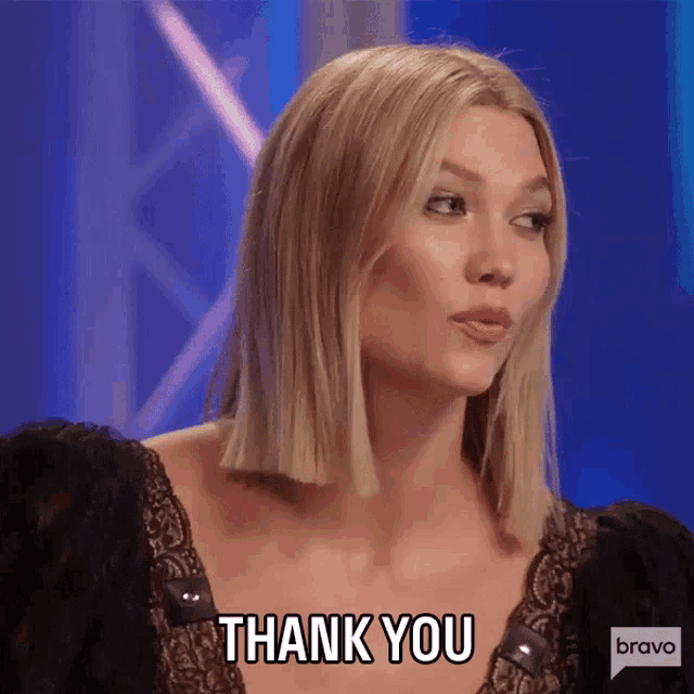 a woman in a black lace top says thank you