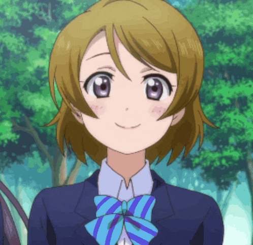 a girl with brown hair and purple eyes is wearing a blue and blue striped bow tie