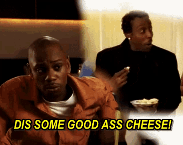 a man sitting at a table with the words dis some good ass cheese behind him