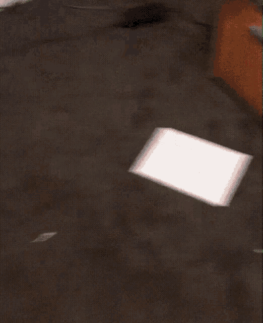 a blurred image of a red and black carpeted floor