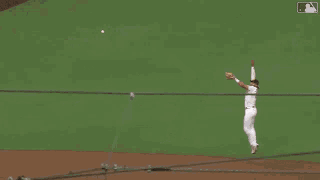 a padres baseball player is sitting on the ground