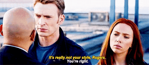 captain america , black widow , and rogers are standing next to each other and talking .