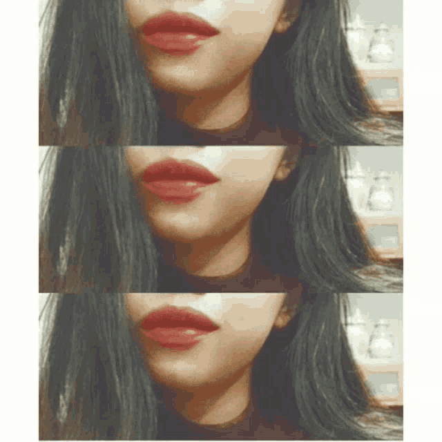 a close up of a woman 's mouth with red lipstick