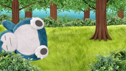 a stuffed animal is laying on its back in a grassy field