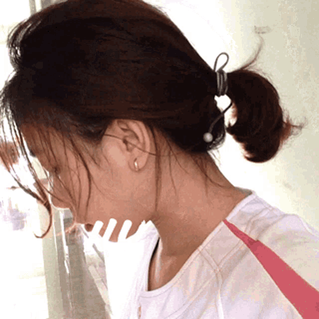 a close up of a woman 's neck and ear