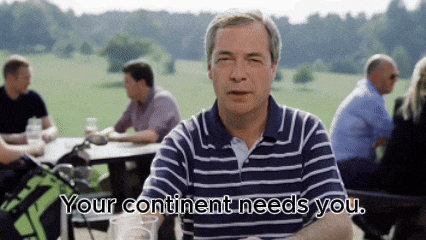 a man sitting at a table with the words your continent needs you