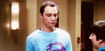 a man in a blue shirt is standing next to a man in a blue shirt .