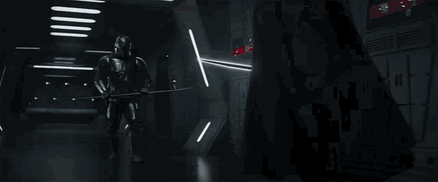 a man is holding a light saber in a dark room while a light shines through a window .