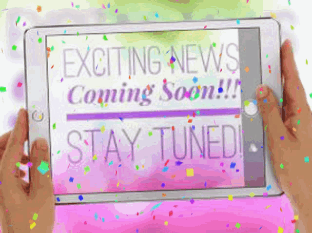 someone is holding a tablet that says exciting news coming soon stay tuned