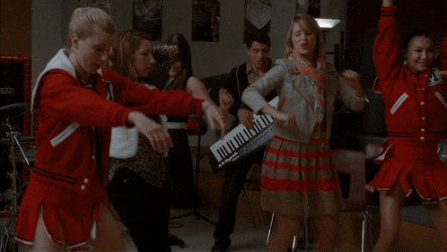 a girl in a red jacket is holding a piece of paper that says ' i 'm a ' on it