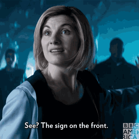 a woman says " see the sign on the front " in front of a bbc america logo