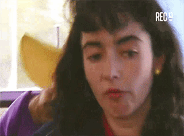 a close up of a woman 's face with the word rece on the bottom left
