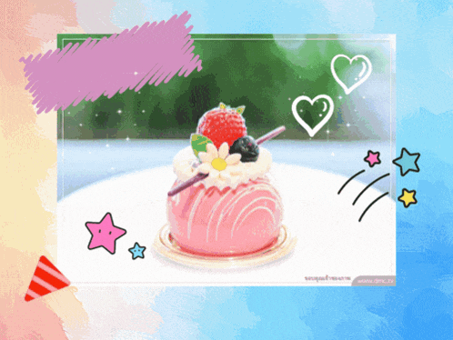 a pink cake with strawberries and blueberries on top of it
