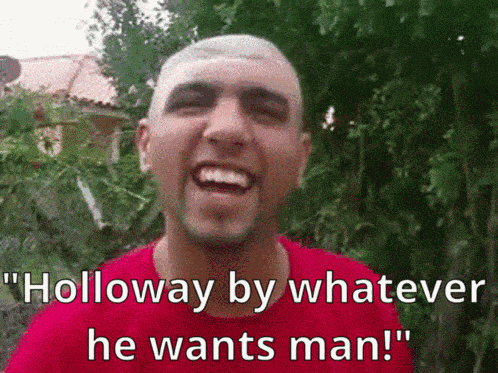 a man in a red shirt is smiling and says " holloway by whatever he wants man ! "