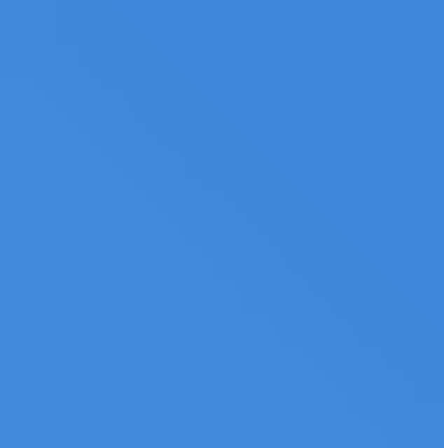 a close up of a blue background with a plain texture