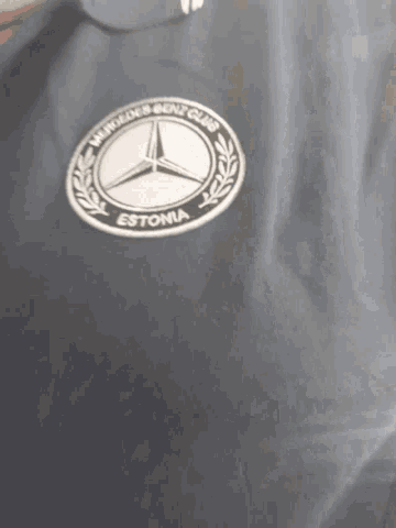 a black shirt with a mercedes logo and the word estonia on it