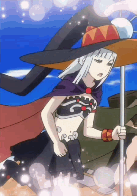 a girl in a witch hat is holding a stick