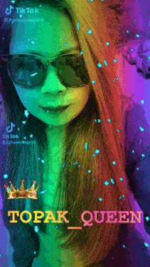 a woman wearing sunglasses and a crown with the name topak queen on it