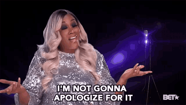 a woman in a sequined dress is saying i 'm not gonna apologize for it