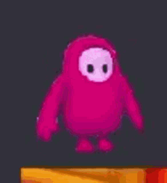 a pink cartoon character is waving his hand in the air .