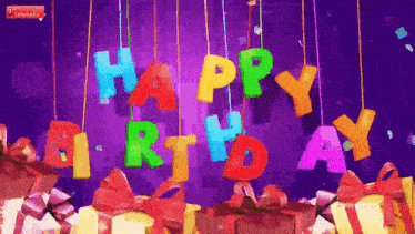 a purple background with the words happy birthday hanging from the ceiling