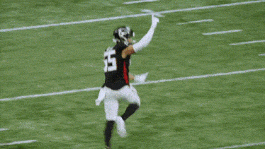 a football player wearing a helmet with the number 28 on it