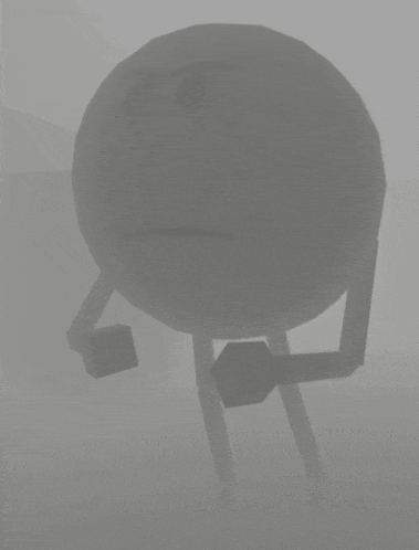 a gray object with a sad face on it is floating in the fog