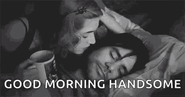a woman is kissing a man on the forehead while a man is sleeping .