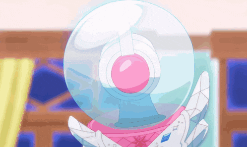 a snow globe with a pink and white ball inside of it