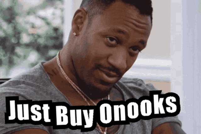 a man with the words just buy onooks written on his face