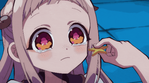 a close up of a girl 's face with tears coming out of it