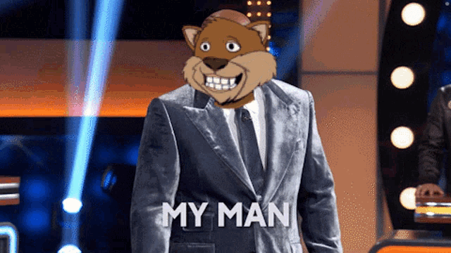 a man in a suit with a cartoon cat on his head and the words my man below him