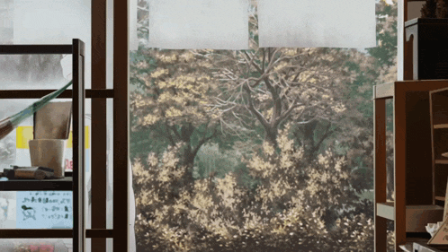 a painting of trees is on display in a room