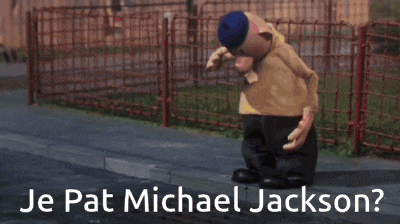 a man in a white suit and hat is dancing in front of a crowd and the words je pat michael jackson
