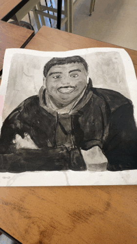 a black and white drawing of a man sitting on a table