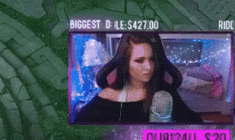 a woman is sitting in front of a microphone with the words biggest 0 le $ 427.00 in the corner