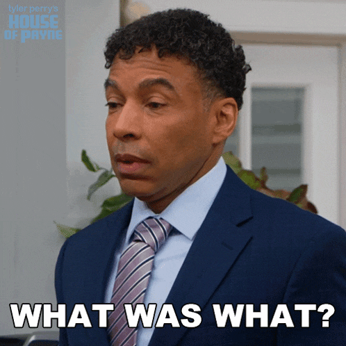 a man in a suit and tie is saying what was what