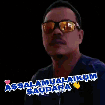 a man wearing sunglasses says assalamualaikum