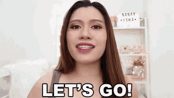 a woman with braces on her teeth is saying `` let 's go '' .